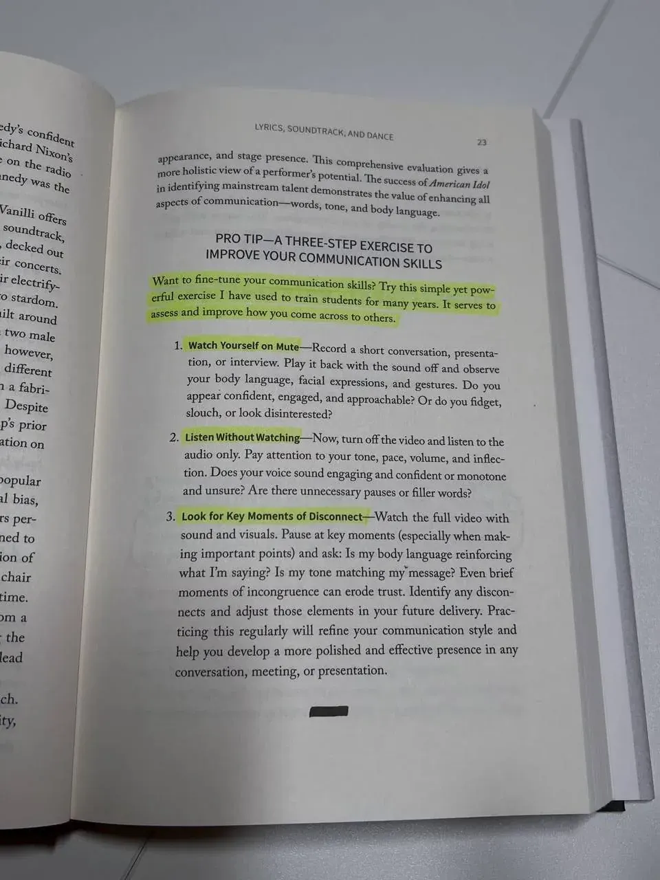 Portrait photo of an open nonfiction book page about communication skills and performance evaluation