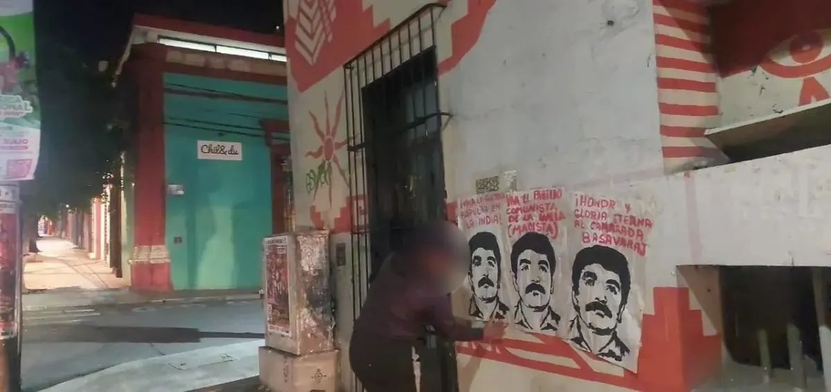 Night street scene with Lenin-style graffiti portraits, evoking Soviet-era propaganda in an urban setting