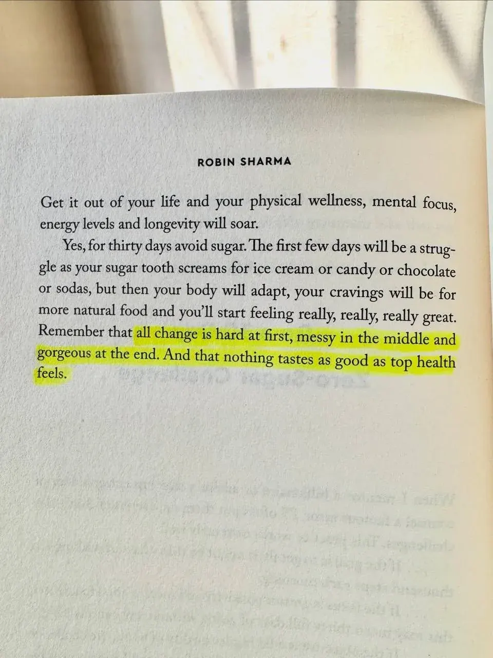 Portrait photo of a Robin Sharma book page with advice about avoiding sugar for better health Portrait photo of a Robin Sharma book page with advice about avoiding sugar for better health