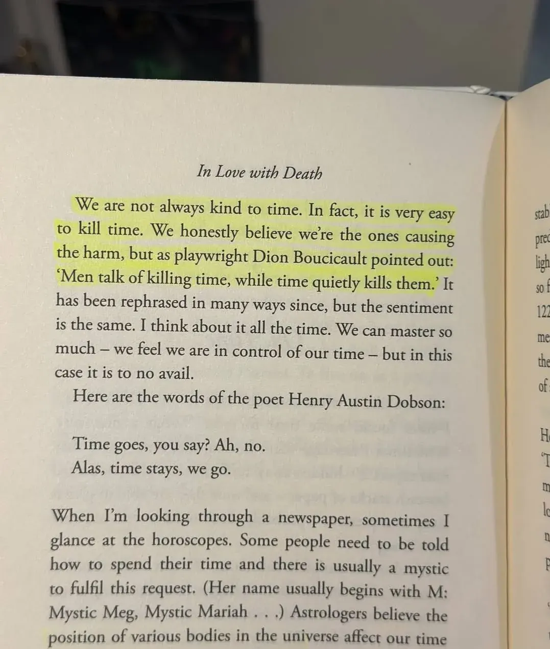Close-up of a printed page titled In Love with Death about how people kill time while time quietly kills them Close-up of a printed page titled In Love with Death about how people kill time while time quietly kills them